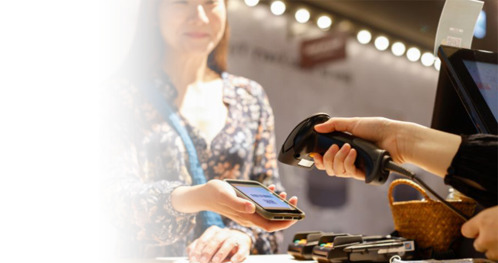 Barcode scanner in action at checkout counter